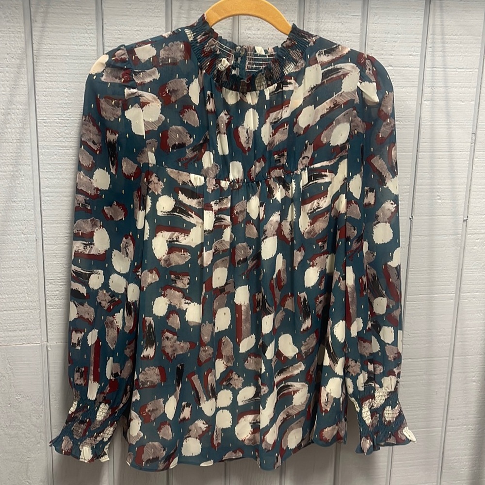 Dressy blouse with smock wrist and neck
